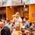 Girl raising beer in beer tent crowd